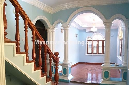 Myanmar real estate - for rent property - No.4565 - Landed house with swimming pool, near Waizayanta Road in South Okkalapa! - downstairs livnig room and stair view